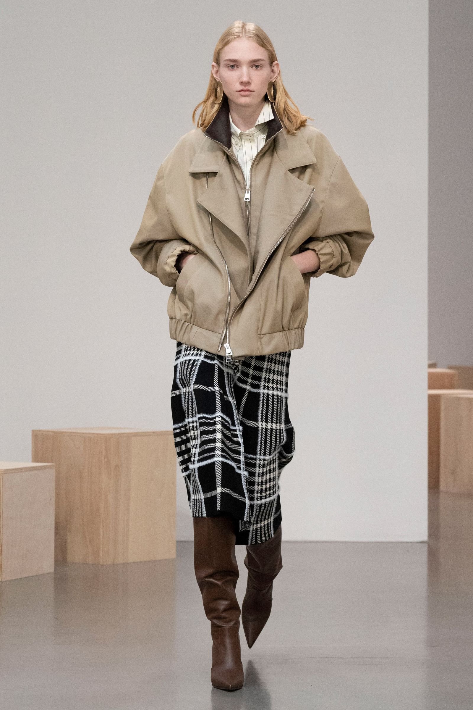 Images may contain clothing coats adult jackets and coats
