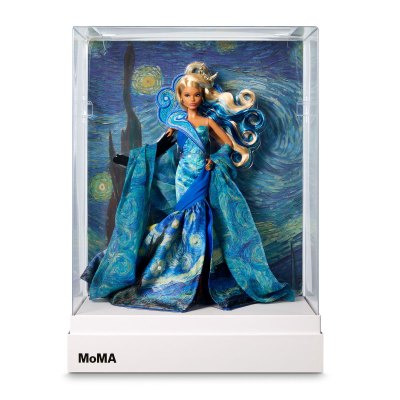 A Barbie doll with a starry night gown in the box. 