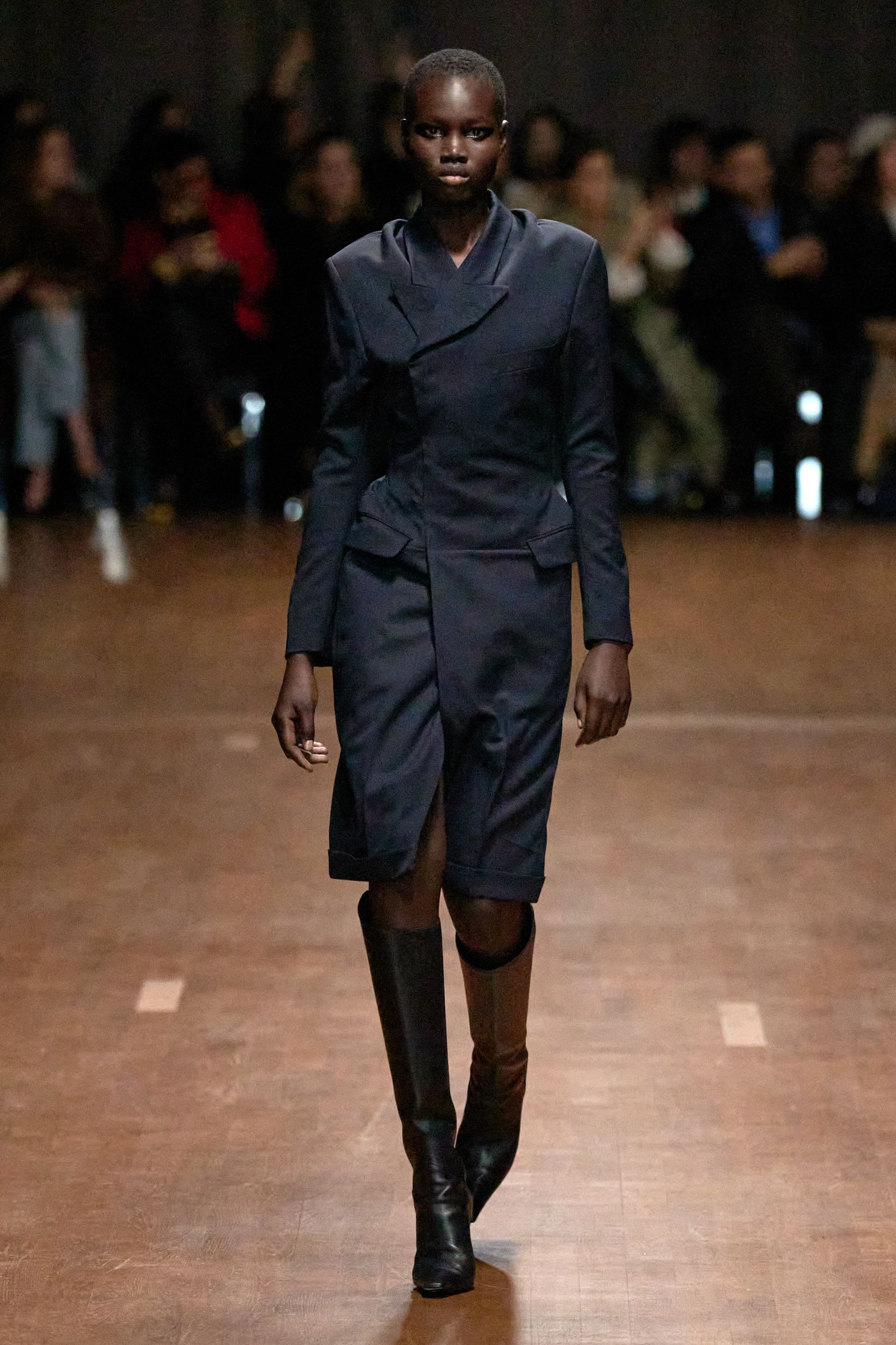 Image may contain Alek Wek man standing adult fashion clothing, outerwear, footwear and shoes
