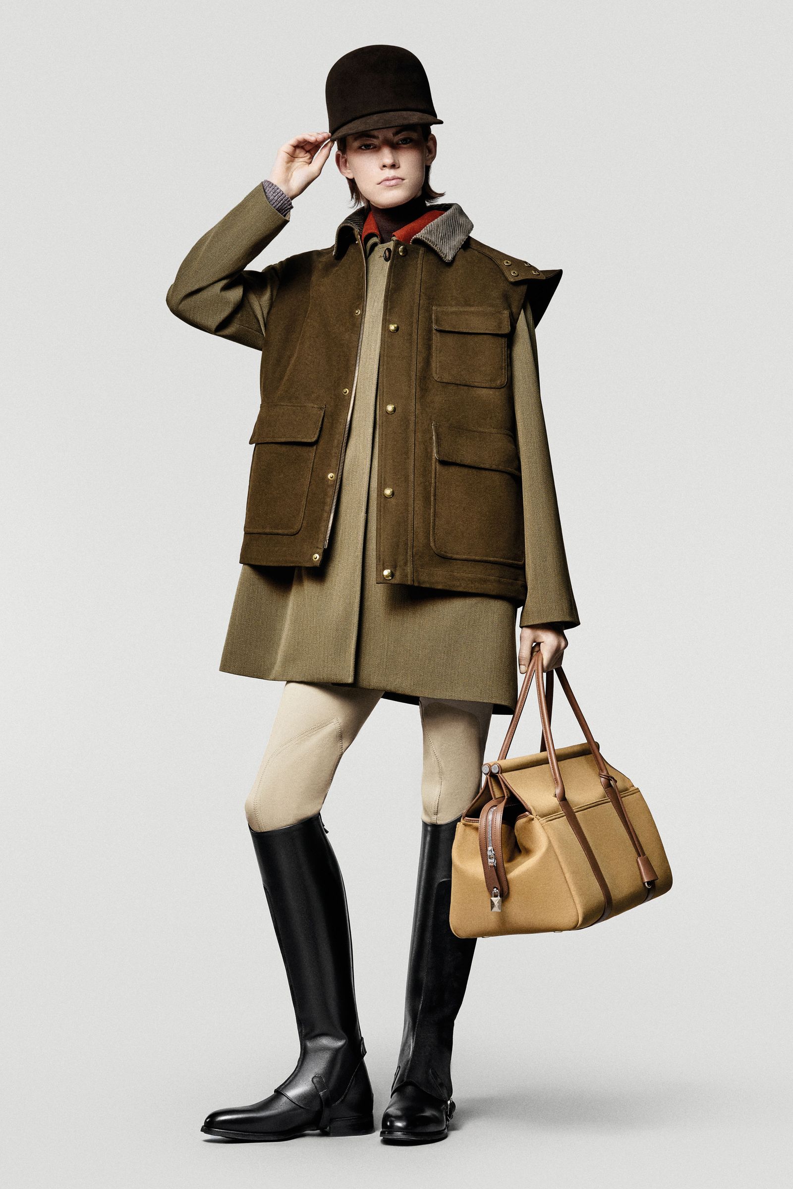 Image may contain Nicoletta Machiavelli Clothing Outerwear Accessories Bags Handbags Coats People Footwear and Shoes