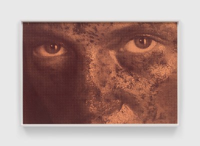 Close-up of a man's eyes and nose with an intense gaze