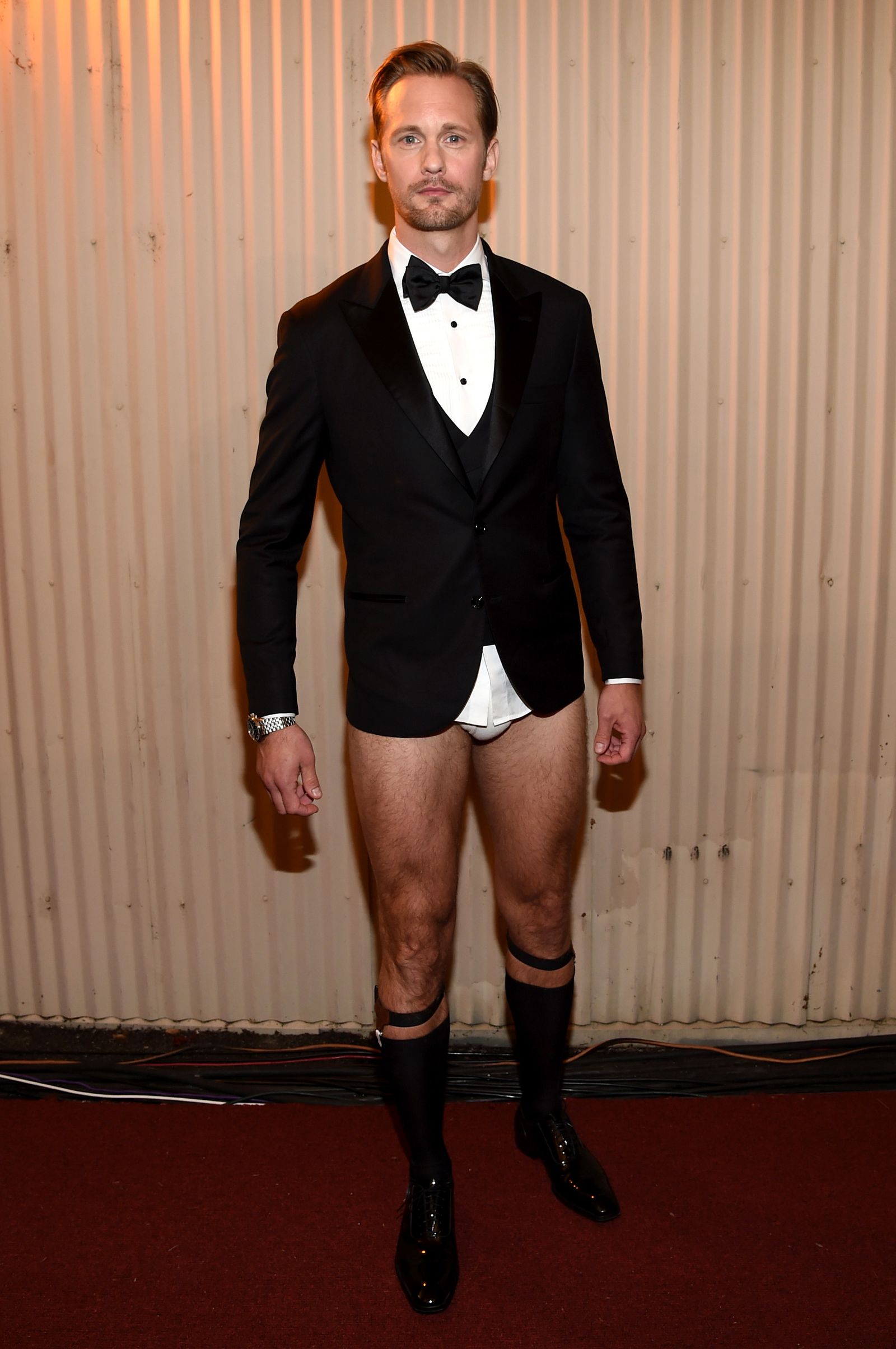 Images may contain Alexander Skarsgård outfit formally wearing suit shorts, jackets, shoes and adults