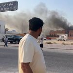 This picture taken from AFPTV footage shows a man looking at billowing smoke after an explosion in Doha, the capital of Qatar, on September 9, 2025. An Israeli military official told AFP that the military carried out air strikes in Doha on September 9, targeting senior leaders of the Palestinian militant group Hamas. (Photo by Jacqueline Penney/AFPTV/AFP) (Photo by Jacqueline Penney/AFPTV/AFP via Getty Images)