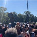 A group of people taking pictures.