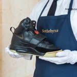 One man was wearing a tie, white gloves and a blue apron that read 