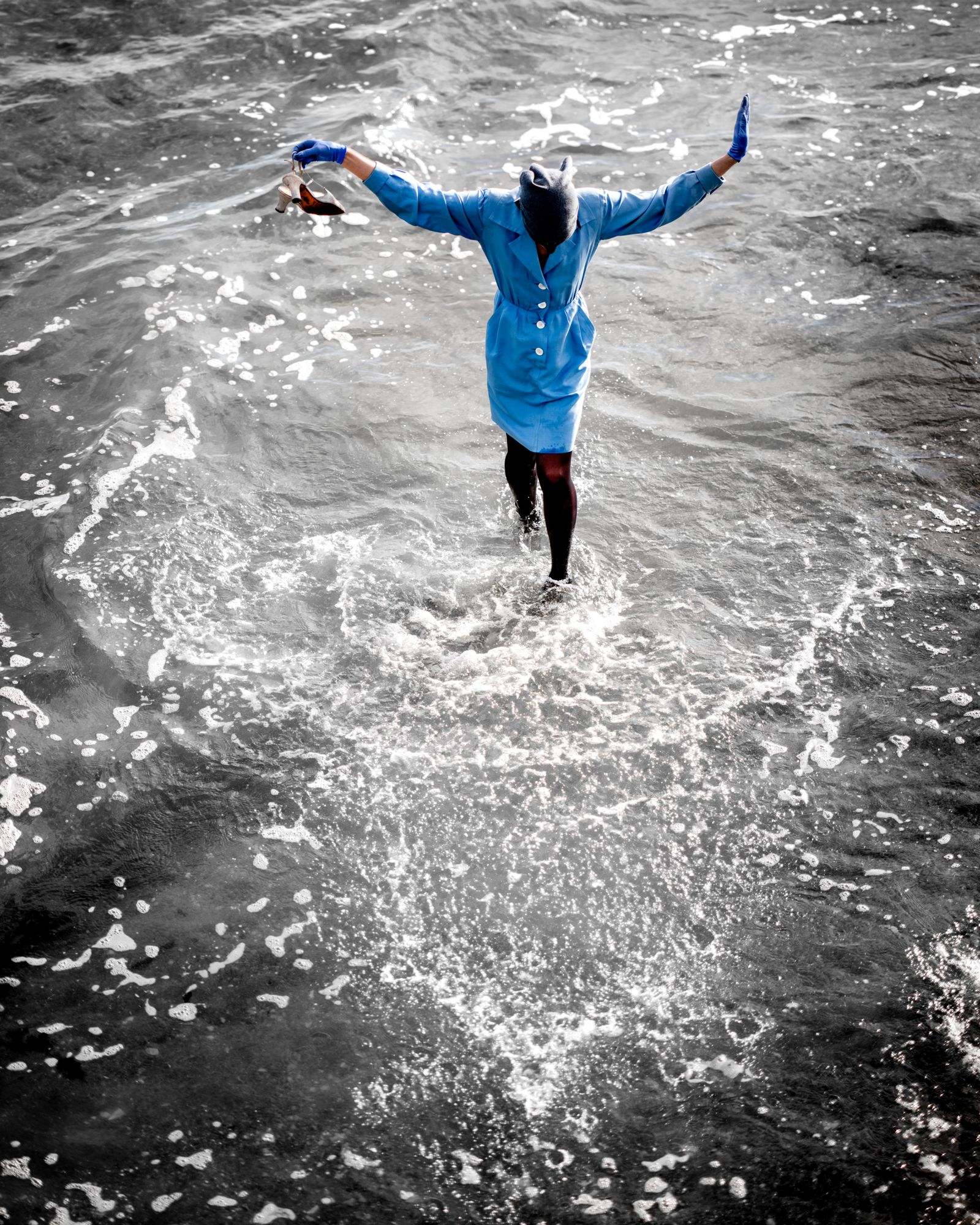 Cruz in blue suit in the water at Coney Island