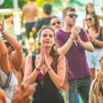A woman clapped in the crowd.