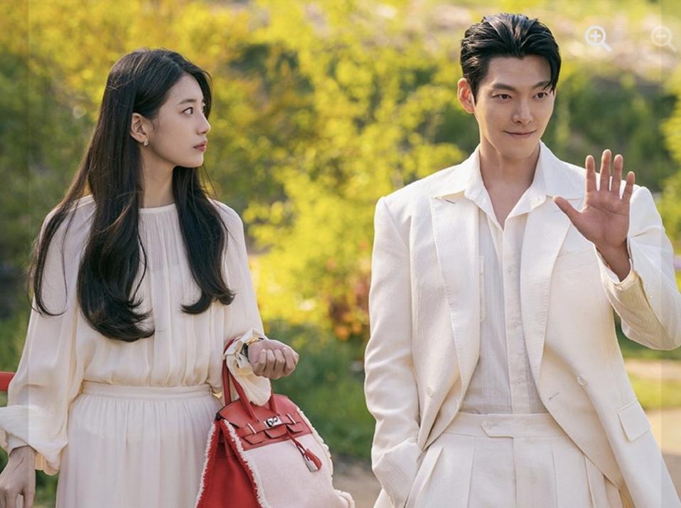 Actress Bae Suzy is wearing a white dress and actor Kim Woo-bin is wearing a white suit.