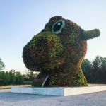 Potomac, MD - July 10, 2017: Jeff Koonss' sculpture Split-Rocker at Glenstone is composed of tens of thousands of flowering plants. This side is a dinosaur side, made up of magenta, orange and yellow flowers. (Photo by Jennifer Hefner for The Washington Post via Getty Images)