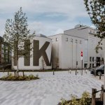 View of the museum building with a square in front.