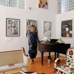 V. Joy Simmons stands next to the piano in her artsy Baldwin Hills home.