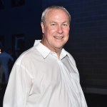 A man wearing a white button-down shirt.