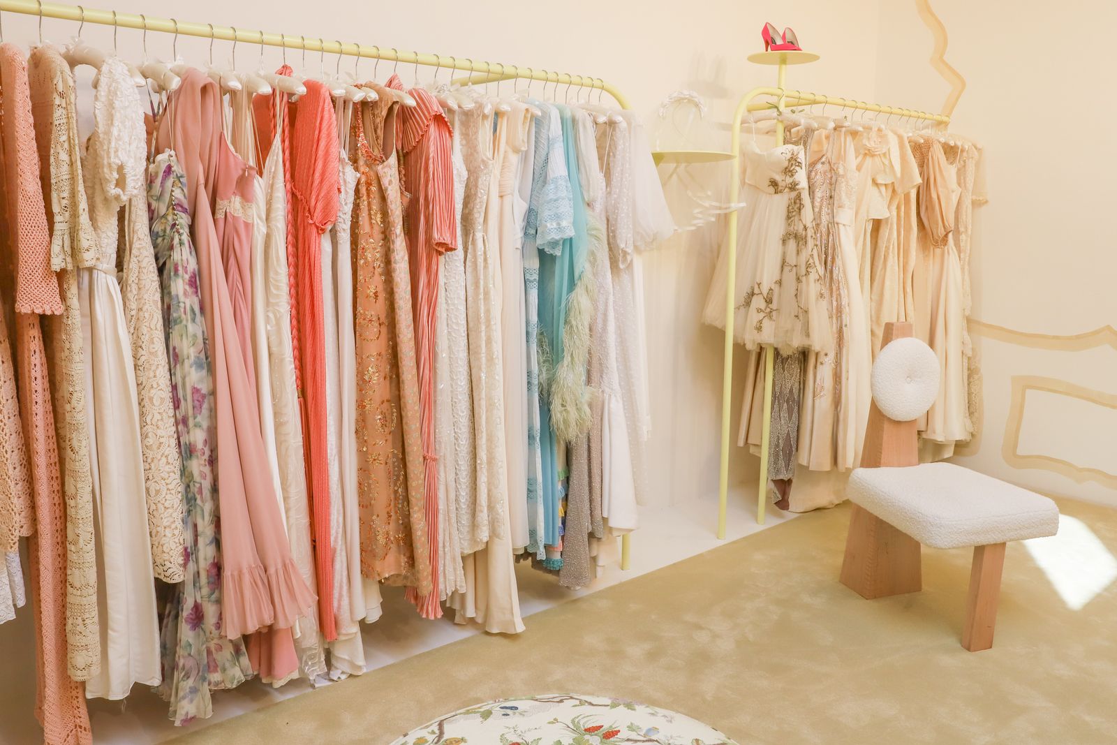 Image may contain dressing room, interior, furniture, bench, closet, boutique and shop