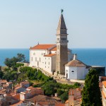 Piran is a small town in southwestern Slovenia, located on the Bay of Piran on the Adriatic Sea. It is one of the three largest towns in Slovenia's Istria peninsula. The town is famous for its medieval architecture, narrow streets and compact houses.
