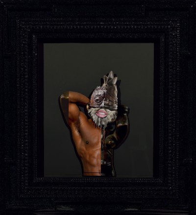 A collage shows the torso of a black man wearing an American mask and a beard.