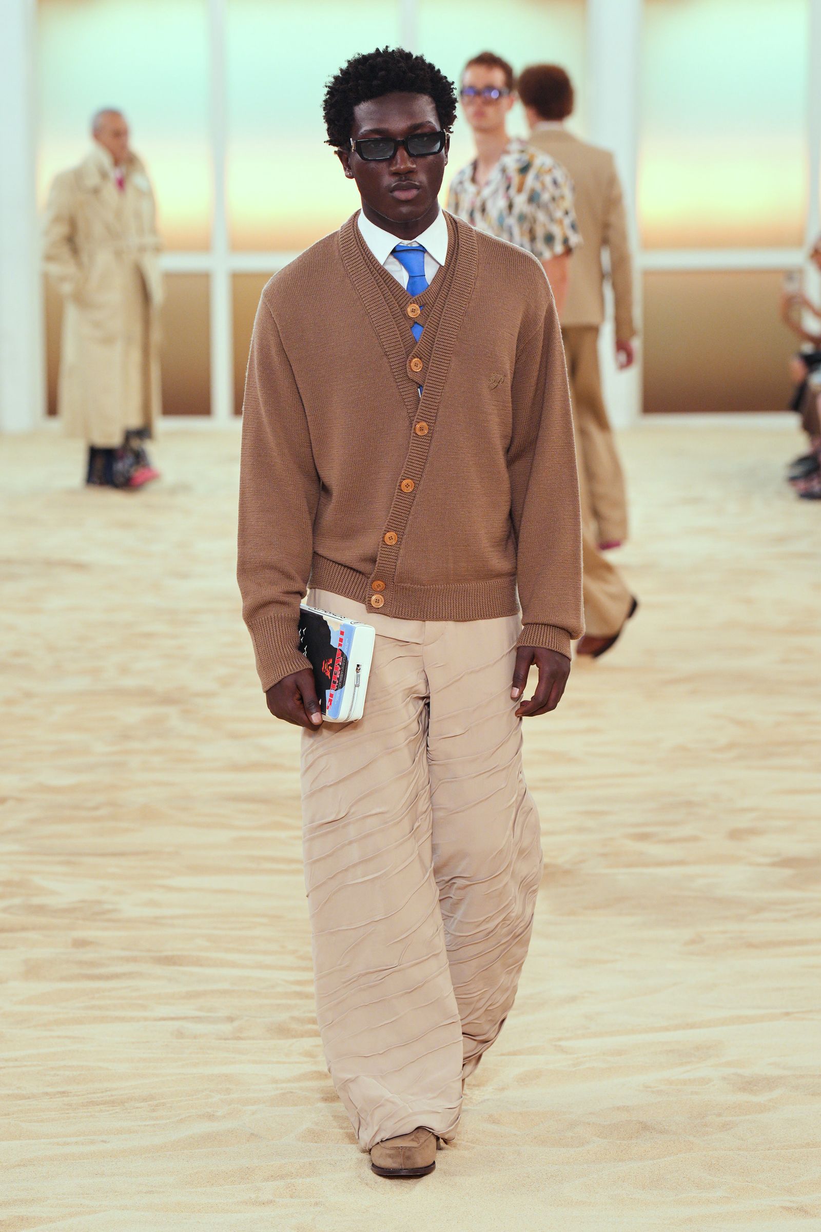 Image may contain adult accessories, glasses, standing apparel, footwear, formal wear, ties and fashion