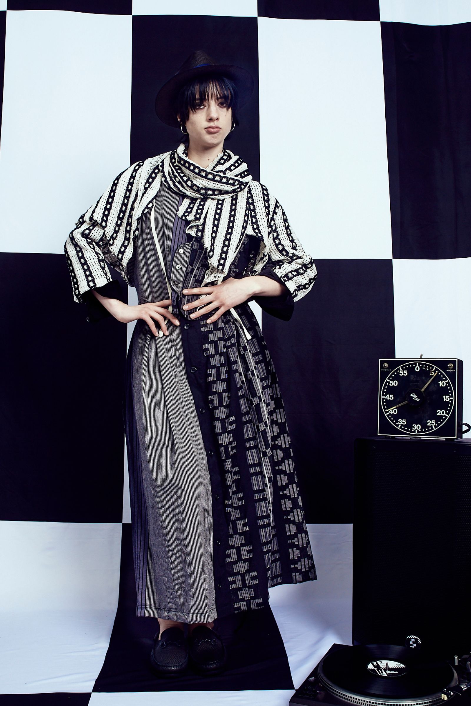 Image may contain Lola Blanc Clothing Dress Fashion Adult Long Sleeve Sleeve Formal Dress and Standing