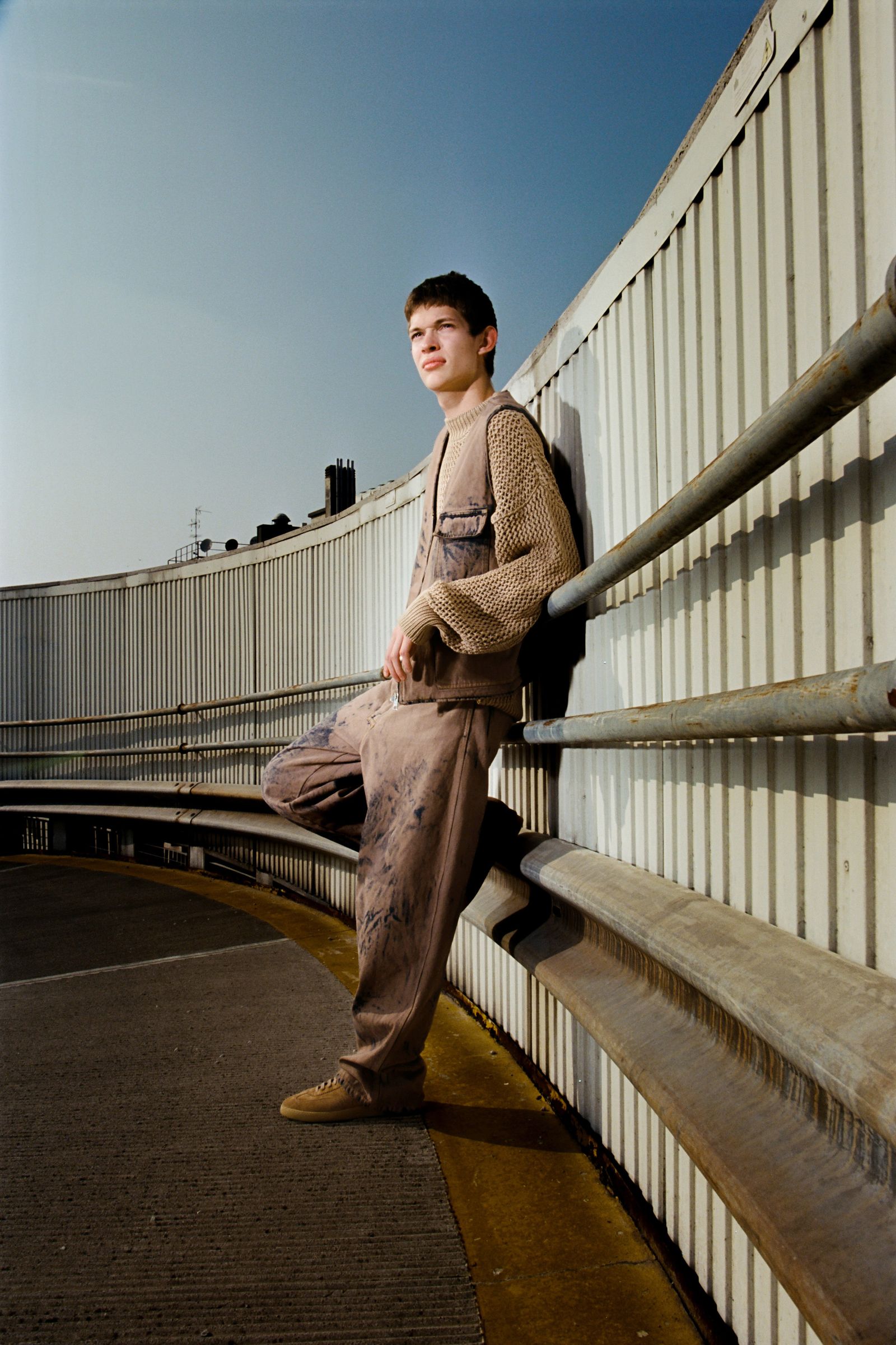 Image may contain Micah Fowler Photography person sitting clothing pants adult face avatar and footwear