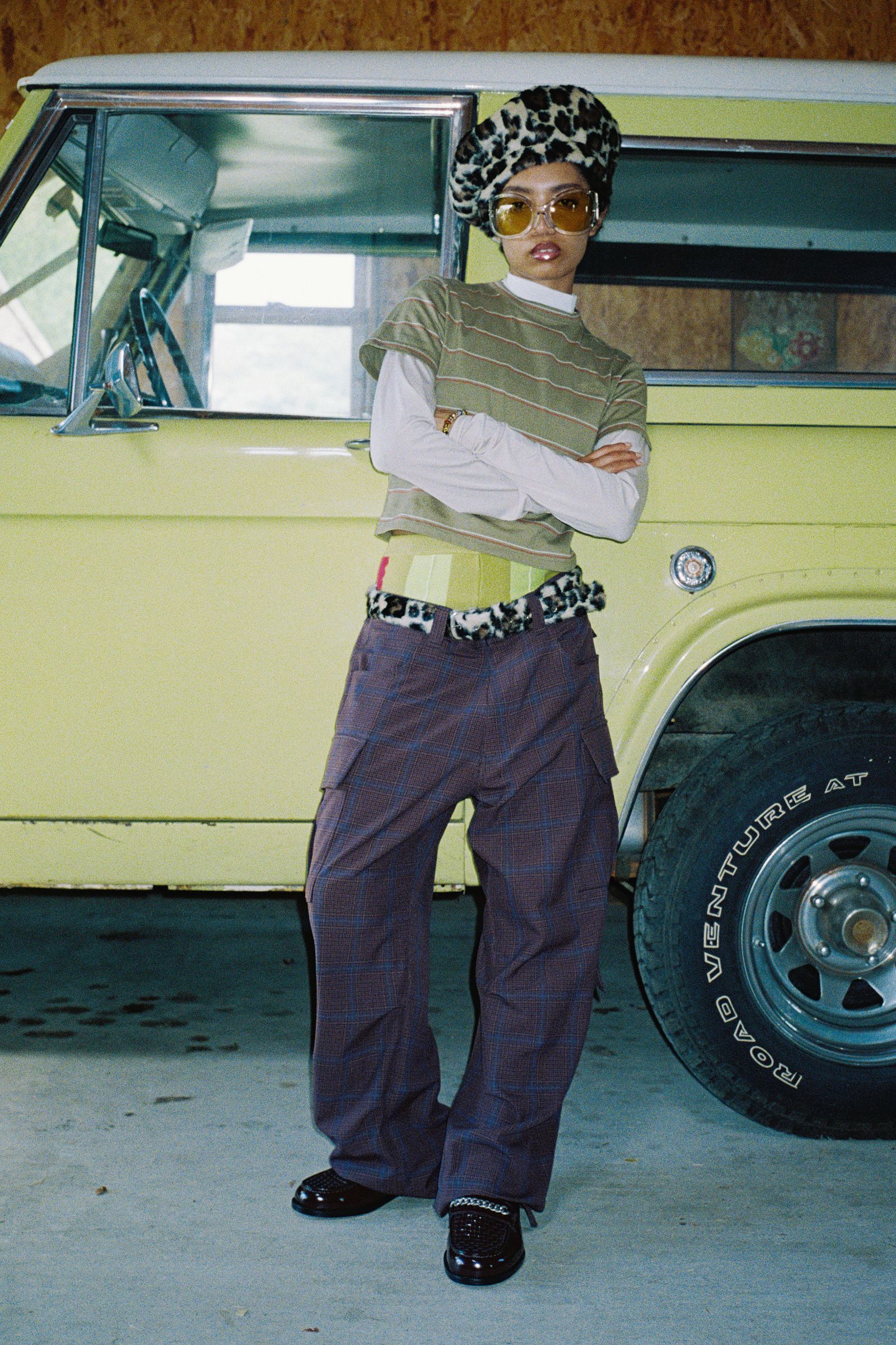 Image may contain clothing, pants, footwear, shoes, adult accessories, eyeglasses, alloy wheels, cars and wheels