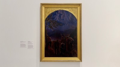 A painting of black figures raising their hands to a deep purple sky.