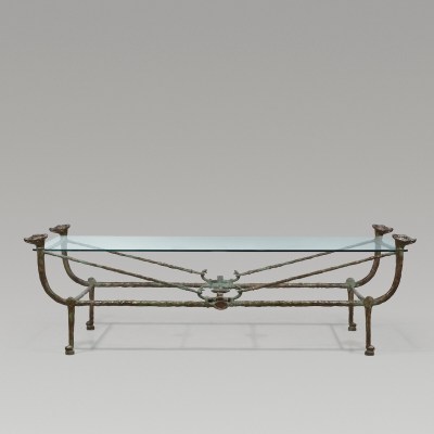 Coffee table with a piece of glass on the metal part. 