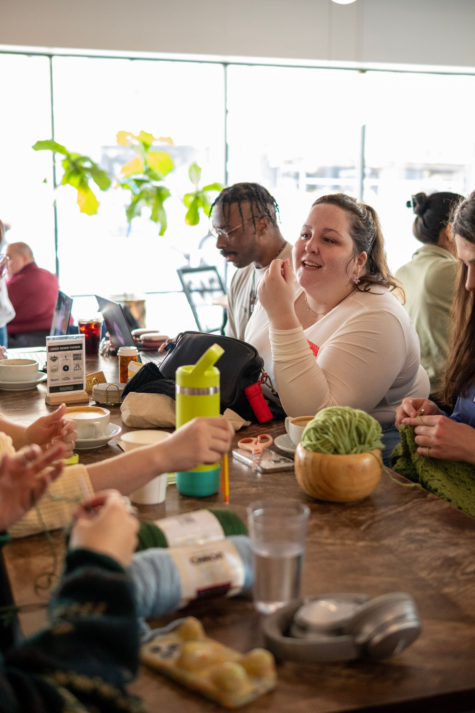 Image may contain adult heads, faces, indoor restaurant, cafeteria, children's brunch, food, people and drinks