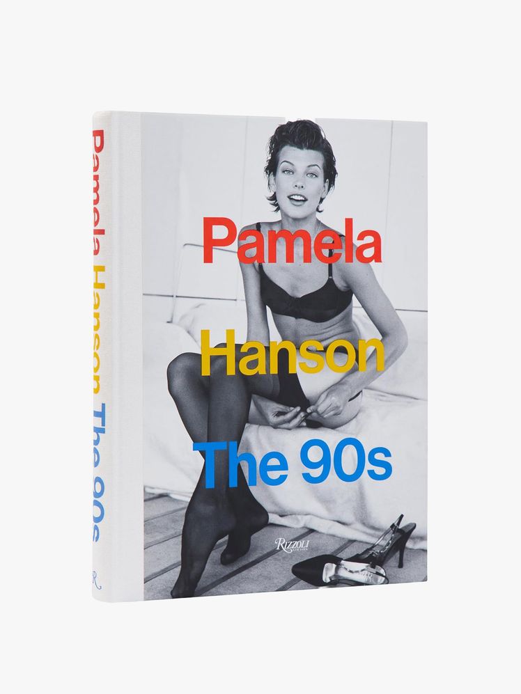 Image may contain: Milla Jovovich, person, face, head, clothes, socks and pantyhose