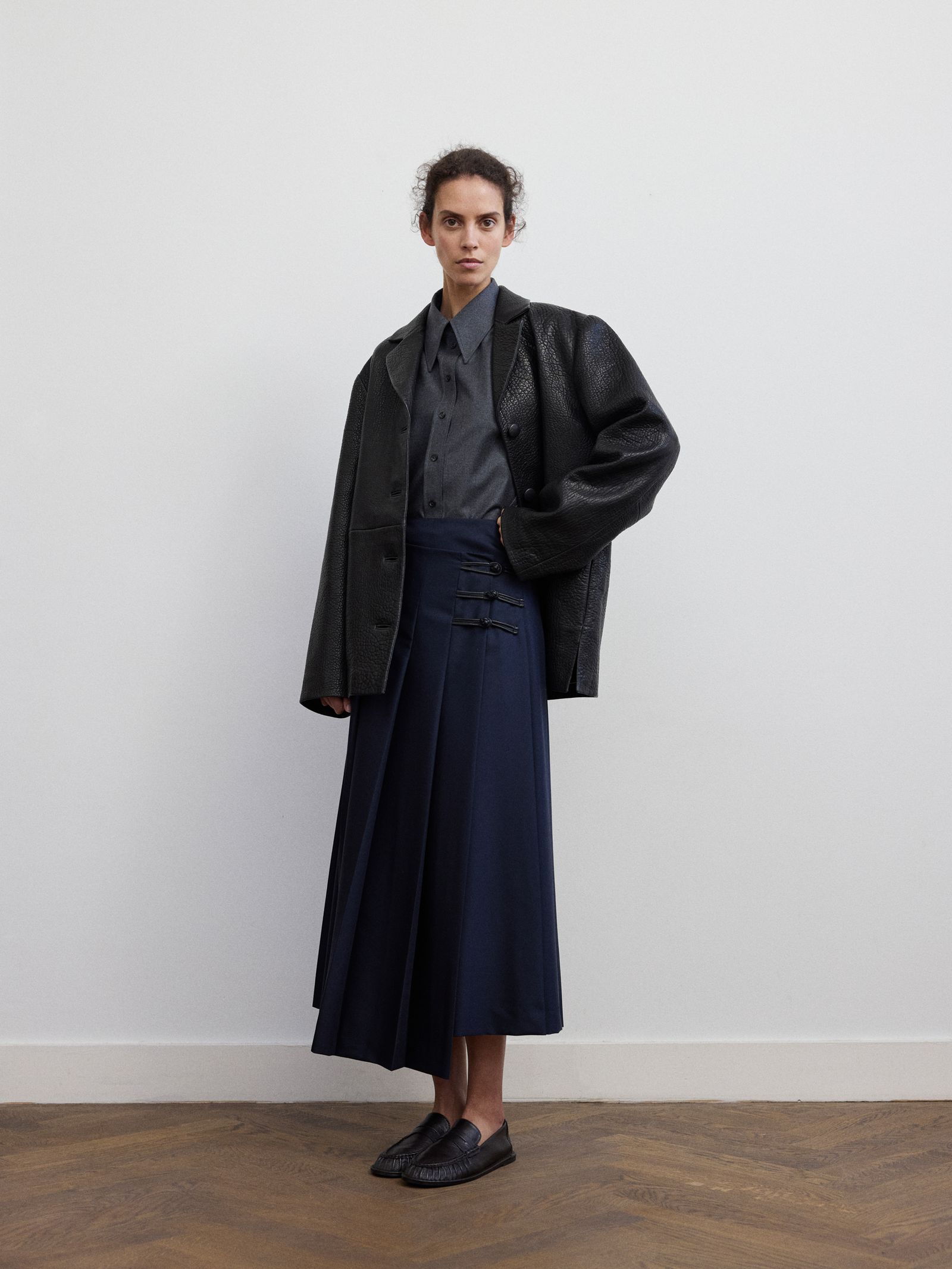 Image may contain clothing, coats, jackets, coats, adults and people