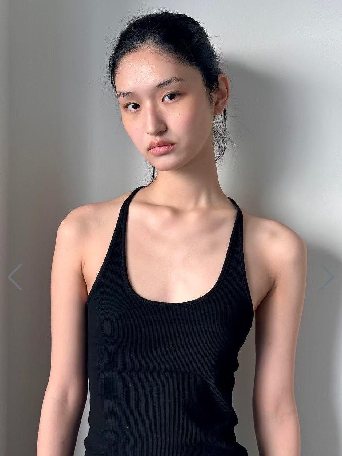 The image may contain adult heads, faces, body parts, necks, shoulders, clothes and vests