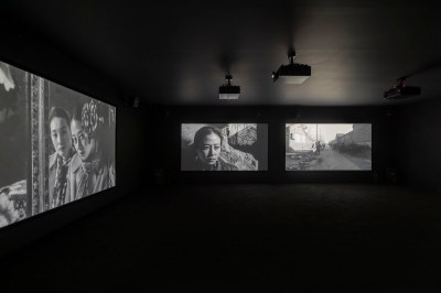 Multi-channel video installation in dark gallery.