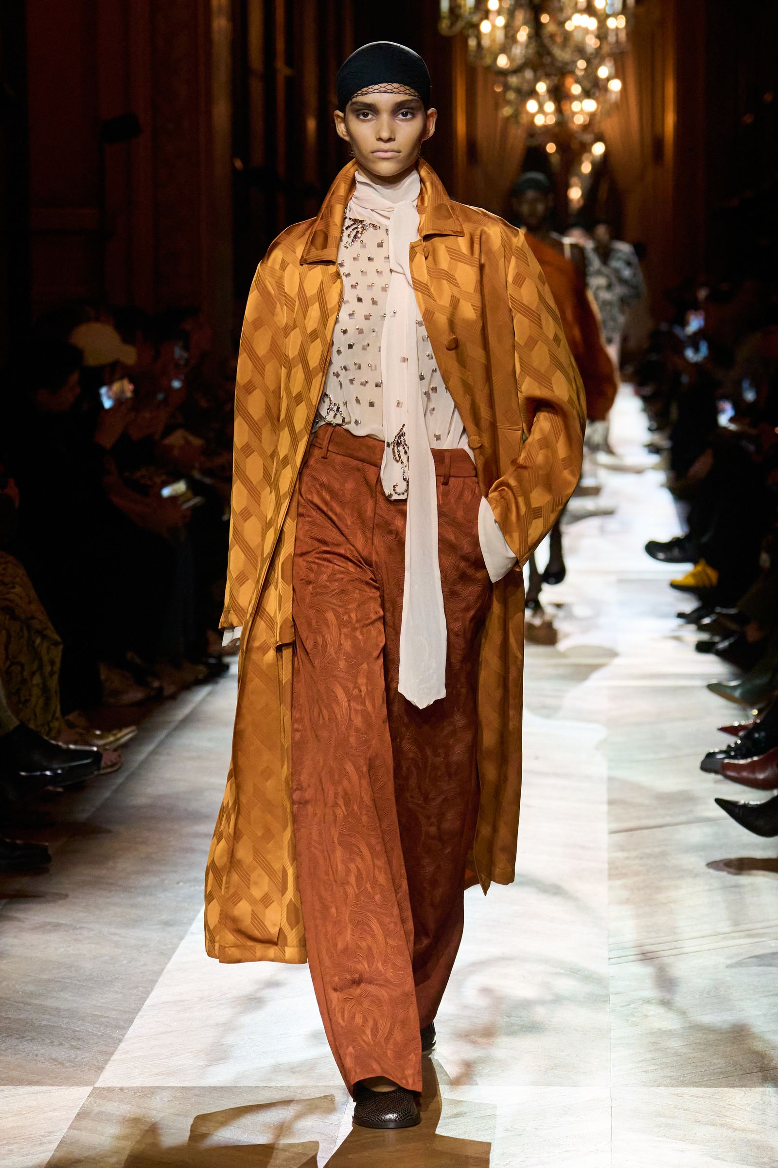 Image may include one person standing Fashion Adult Clothing Footwear Shoes and Hats