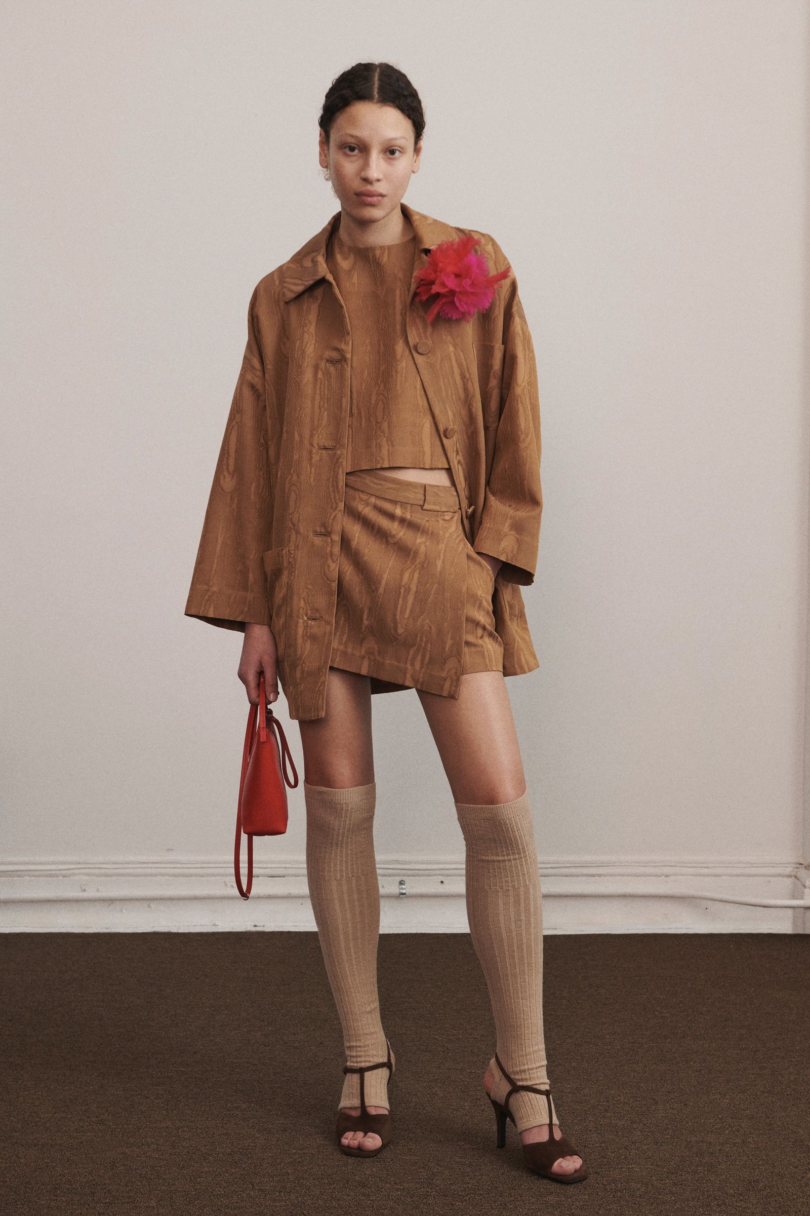 Image may contain clothing, outerwear, footwear, sandals, heels, shoes, people, accessories, bags, handbags and jackets