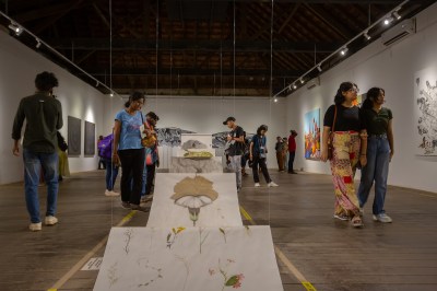 People walking around an art exhibition.