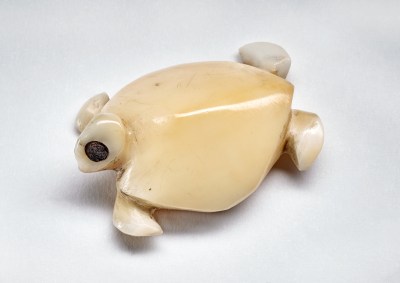 A small sculpture of a turtle.