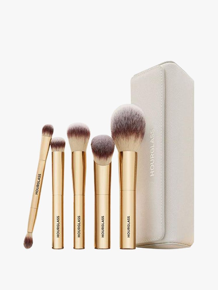 Image may contain: brush, equipment, tools, head, person, face and cosmetics