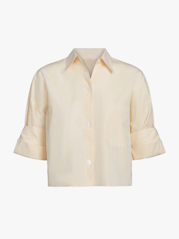 Image may contain: clothes, shirt, dress shirt, blouse, home decor and linen