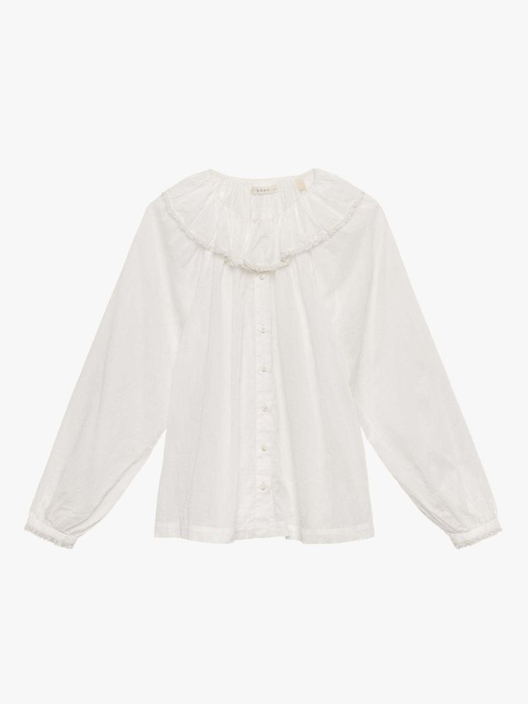 Image may contain: shirt, clothing, long sleeves, sleeves, knitwear and sweater