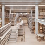 Library image showing stairs and bookshelves.