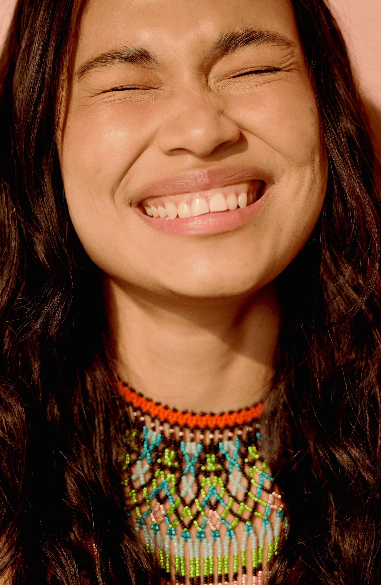 Image may contain face, happy head, people, smile, adult, body, part, mouth and accessories