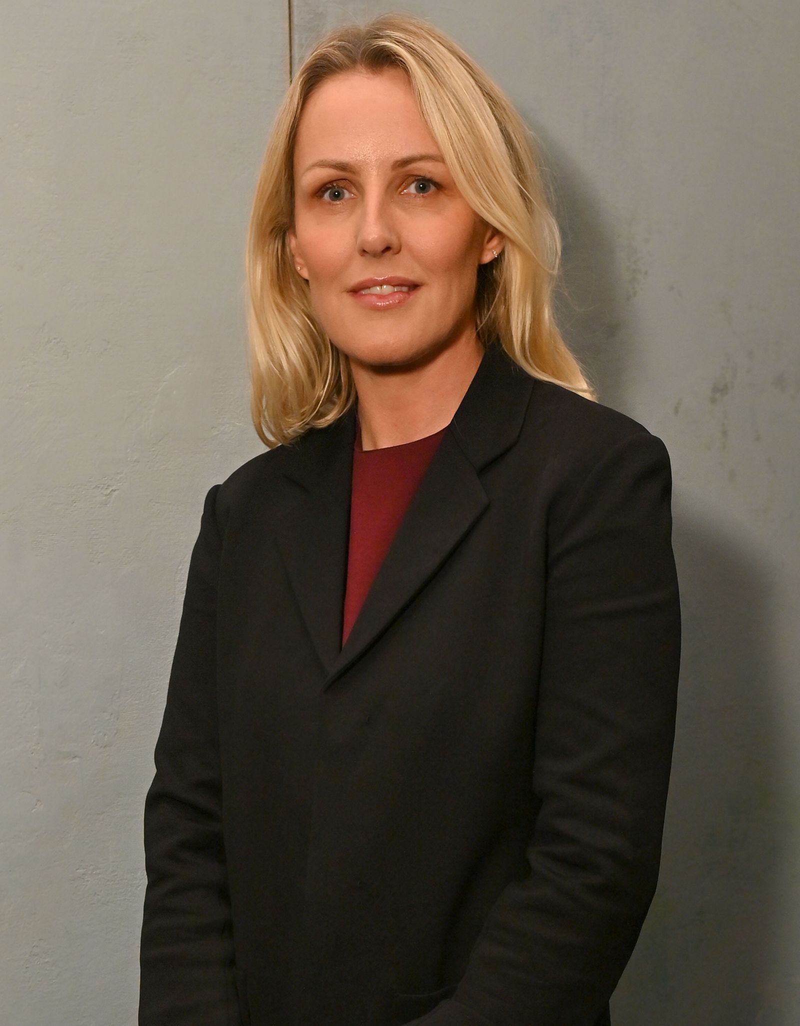 Image may contain blazers, coats, jackets, blond hair, faces, head shots, portraits and adults