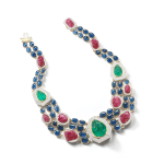A very sparkling necklace engraved with emeralds, rubies and sapphire cabochons.