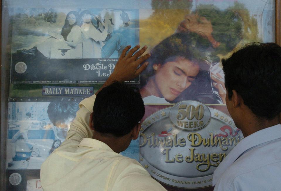 Movie fans look at popu posters