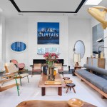 The modern living room features works by Ed Ruscha, Martin Kippenberger and Wade Guyton.