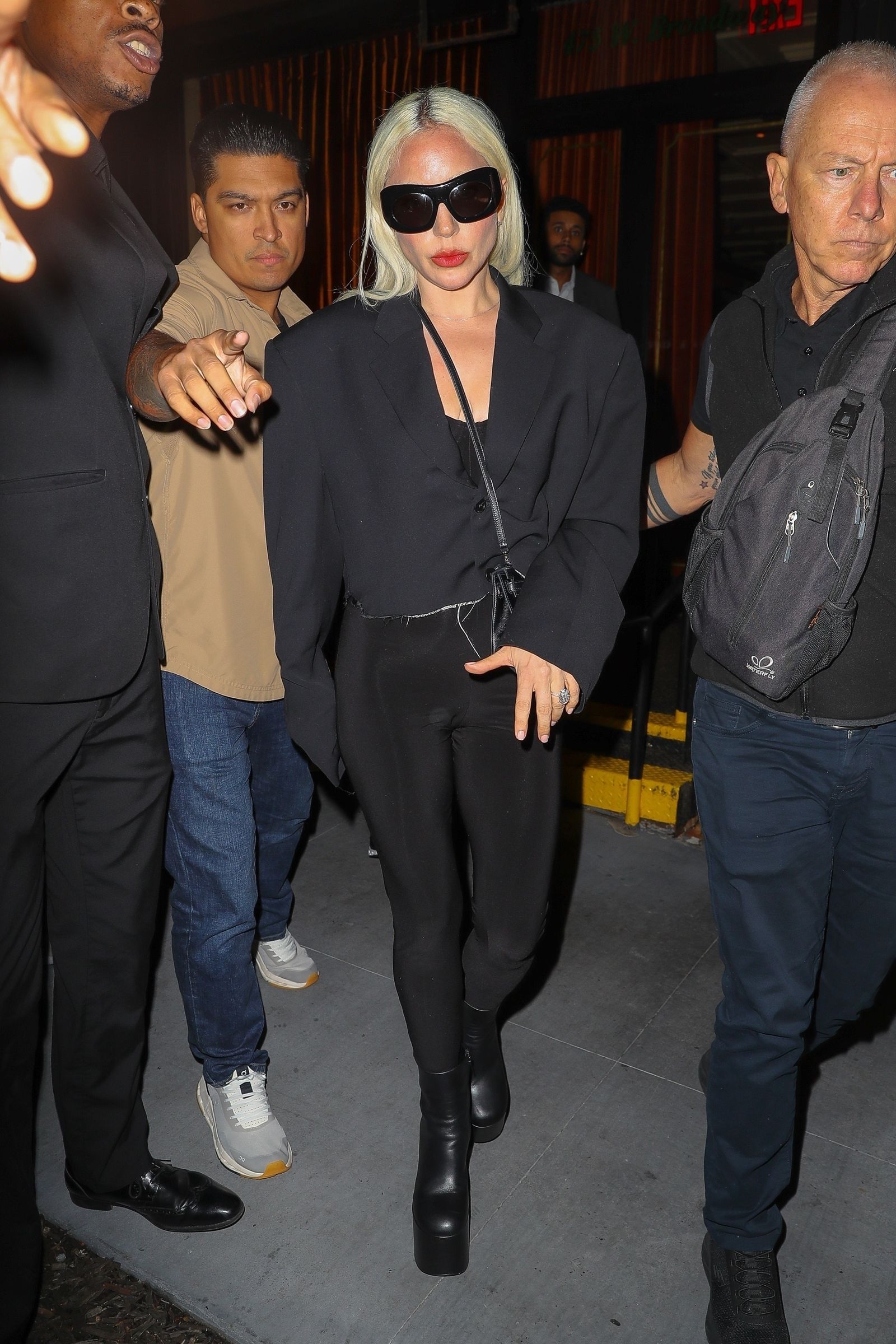 Lady Gaga shows off her engagement ring as she leaves a corner store with fiancé Michael Polanski in New York