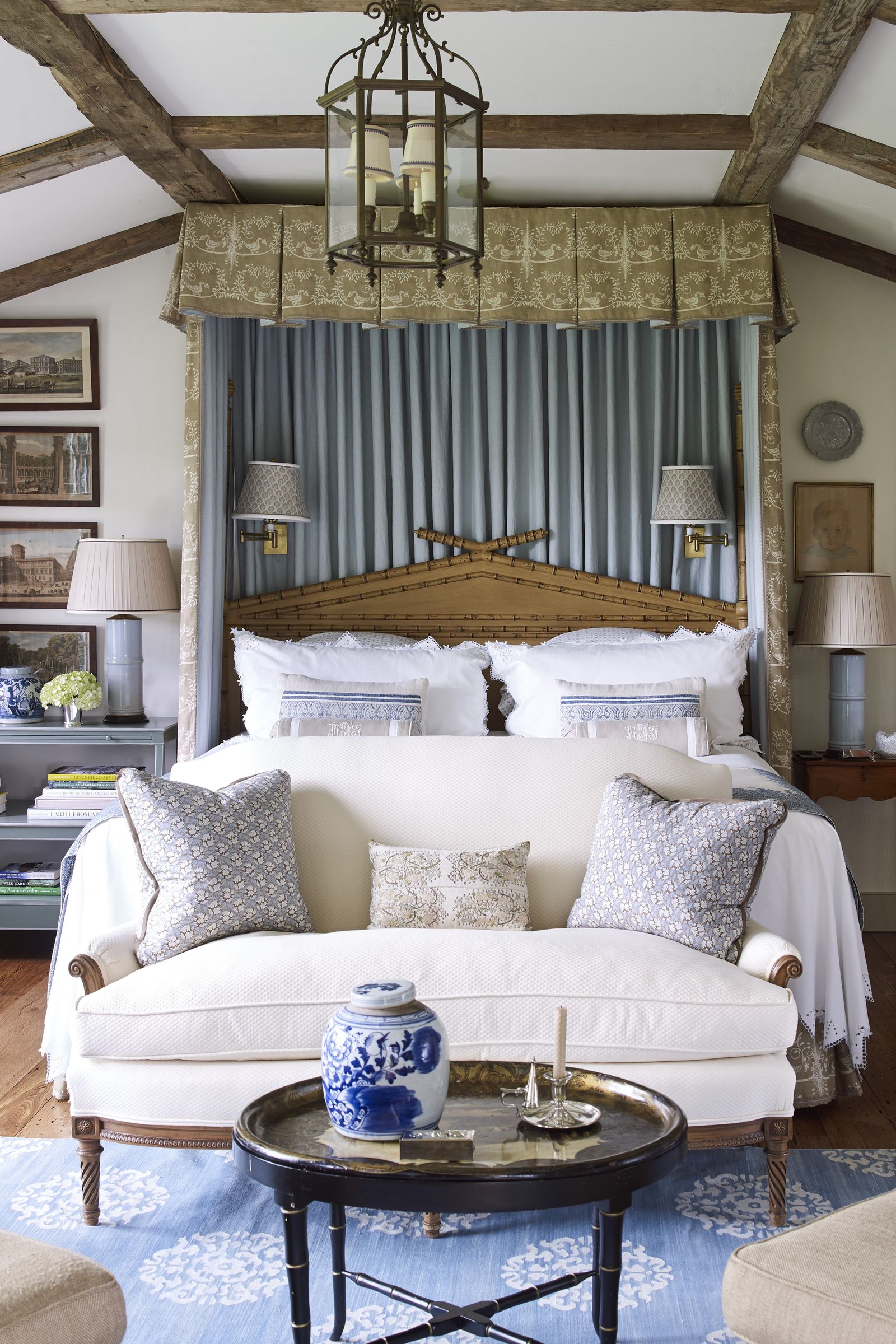 Image may contain interior furniture, bed, bedroom, lamp, art painting, home decor, sofa, candle, table and rug