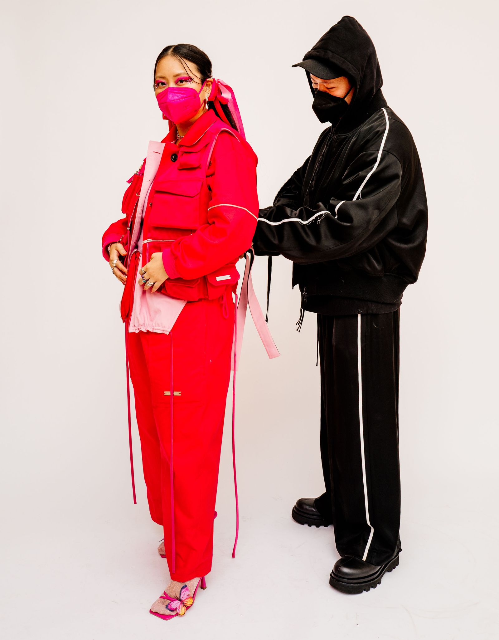 Image may contain clothing, outerwear, adult clothing, hoodies, knitwear, sweaters, sweatshirts, hooded jackets and fashion