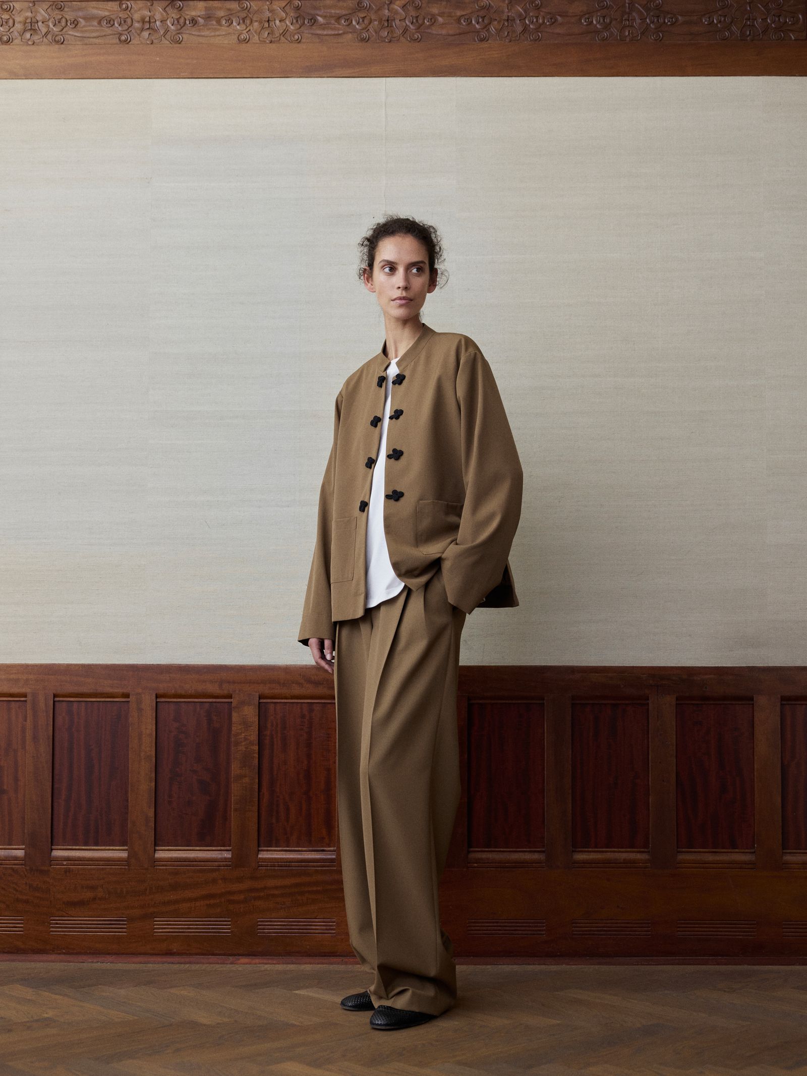 Image may contain clothing, coats, adults and standing