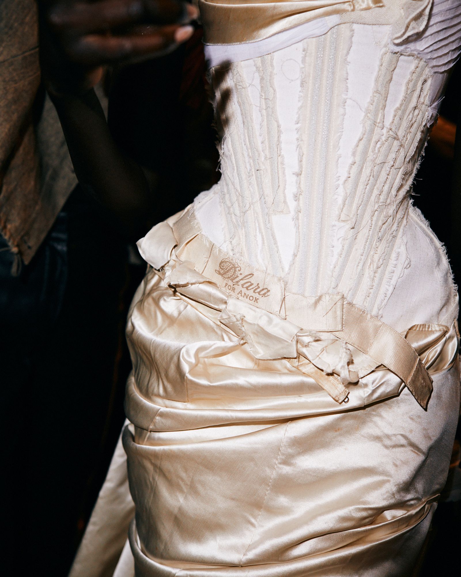 Image may contain clothing, dress, fashion, formal, wedding, wedding dress, evening dress, adult and personal