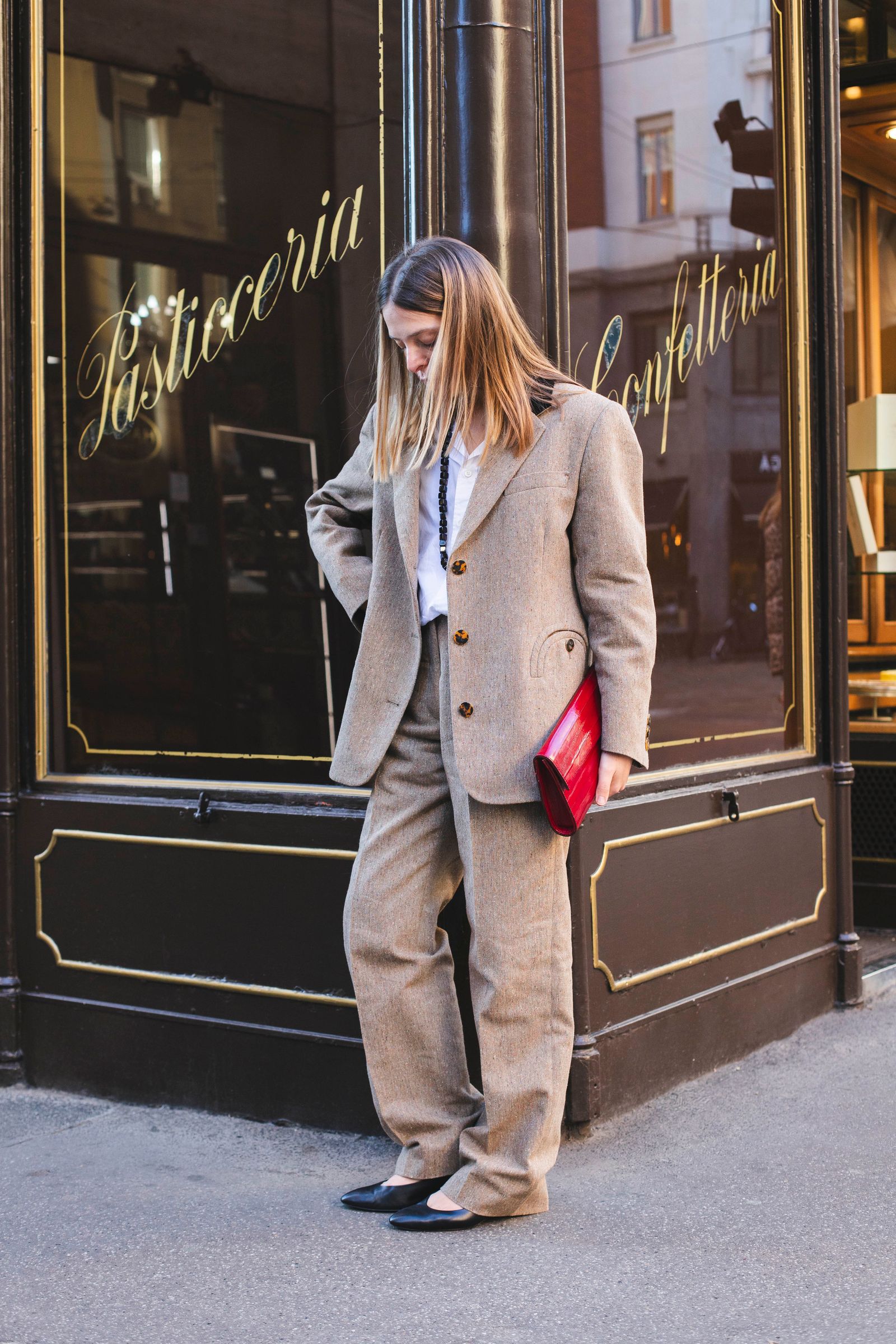 Pictures may contain clothing, jackets, blazers, formal suits, pants, adults and coats