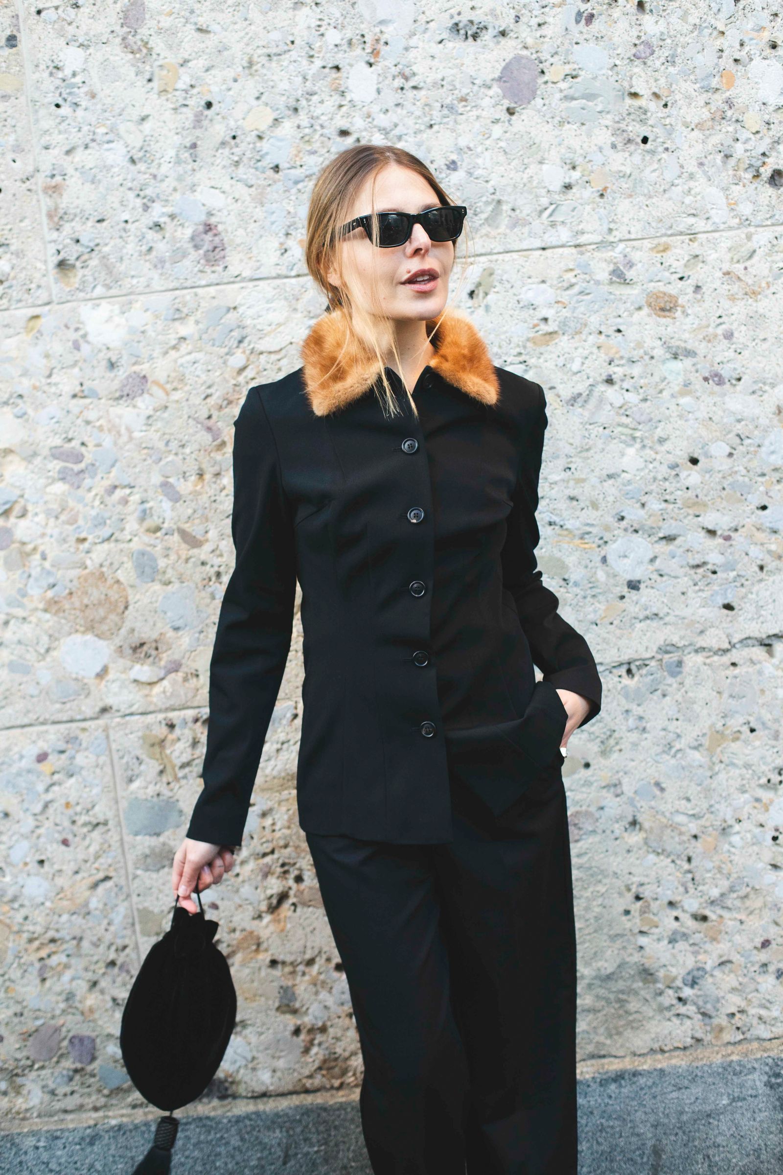 Image may contain blazer, coat, formal wear, jacket, suit, adult, accessory, bag, tote and sleeves